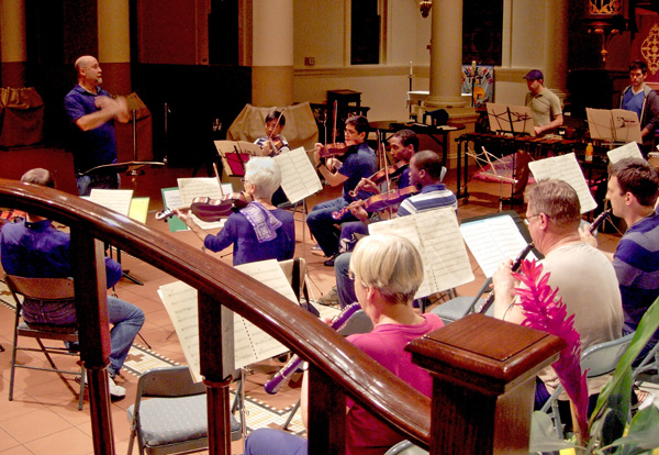 Composer Brian Wilbur Grundstrom rehearses the Queer Urban Orchestra for the upcoming premiere of his "Jubilation! Dance for Orchestra"